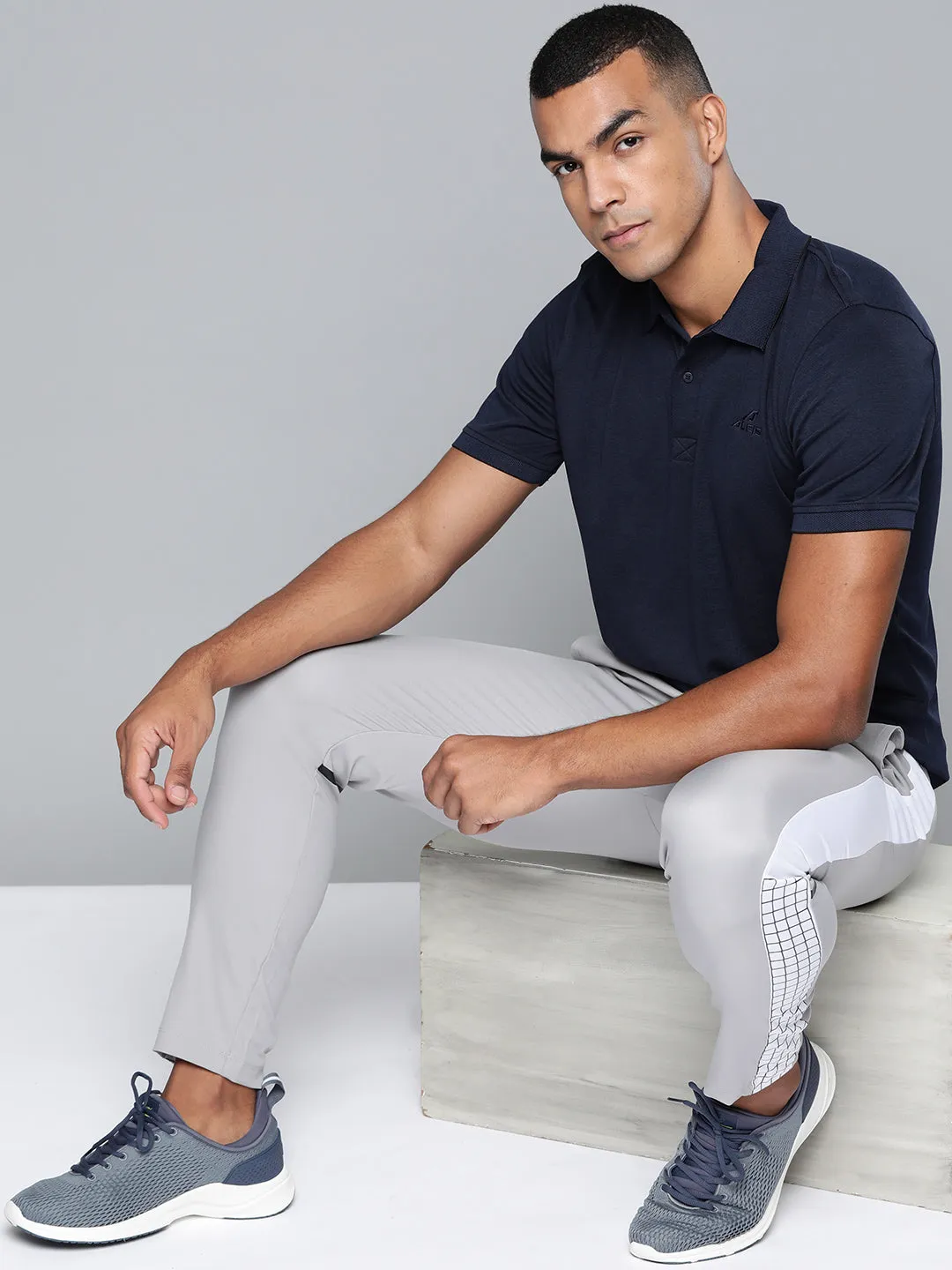 Alcis Men Navy Blue Solid Polo Collar T-shirt Colorfast Technology