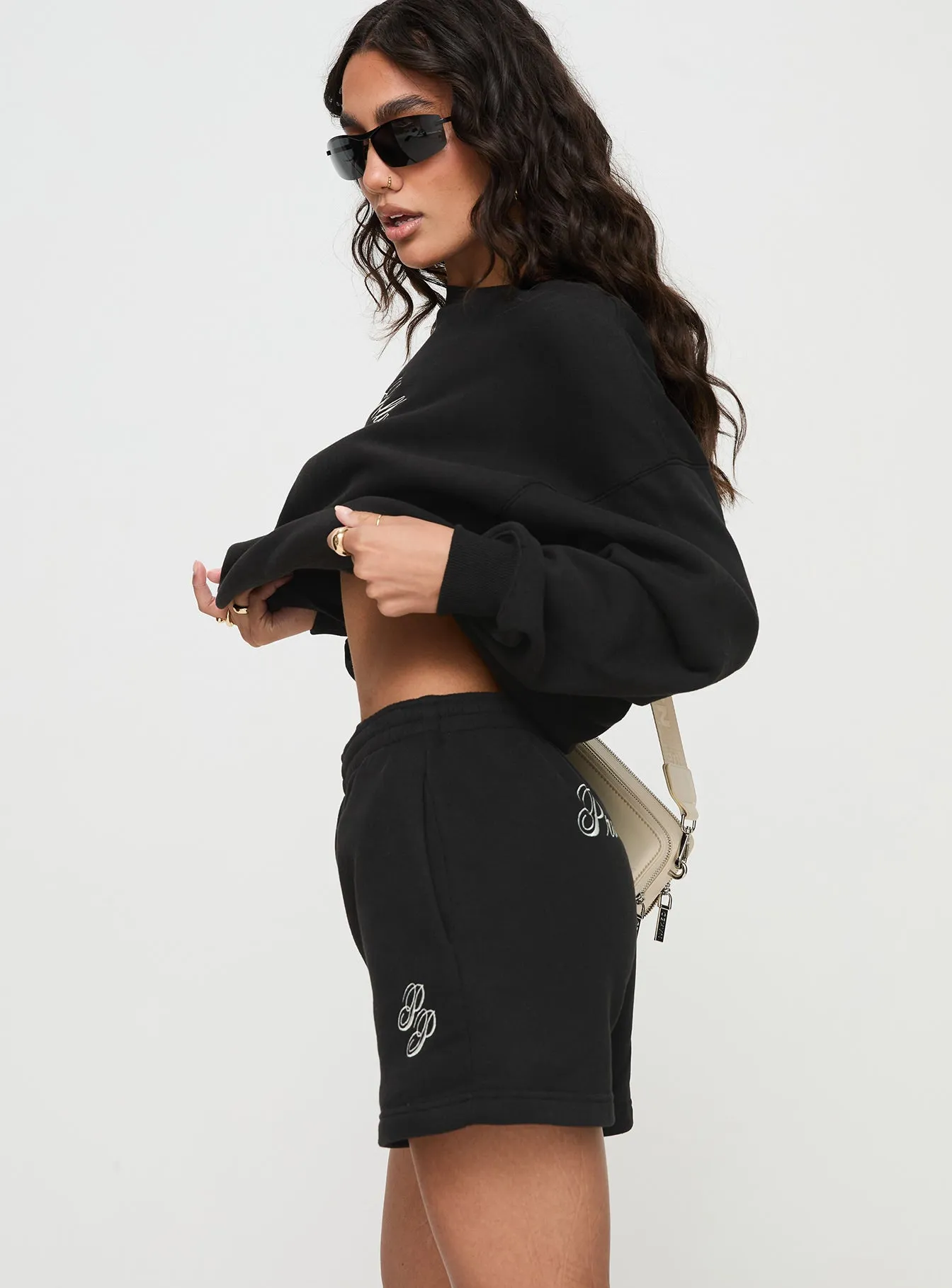 Princess Polly Track Shorts Cursive Text Black Sand Bio Glow