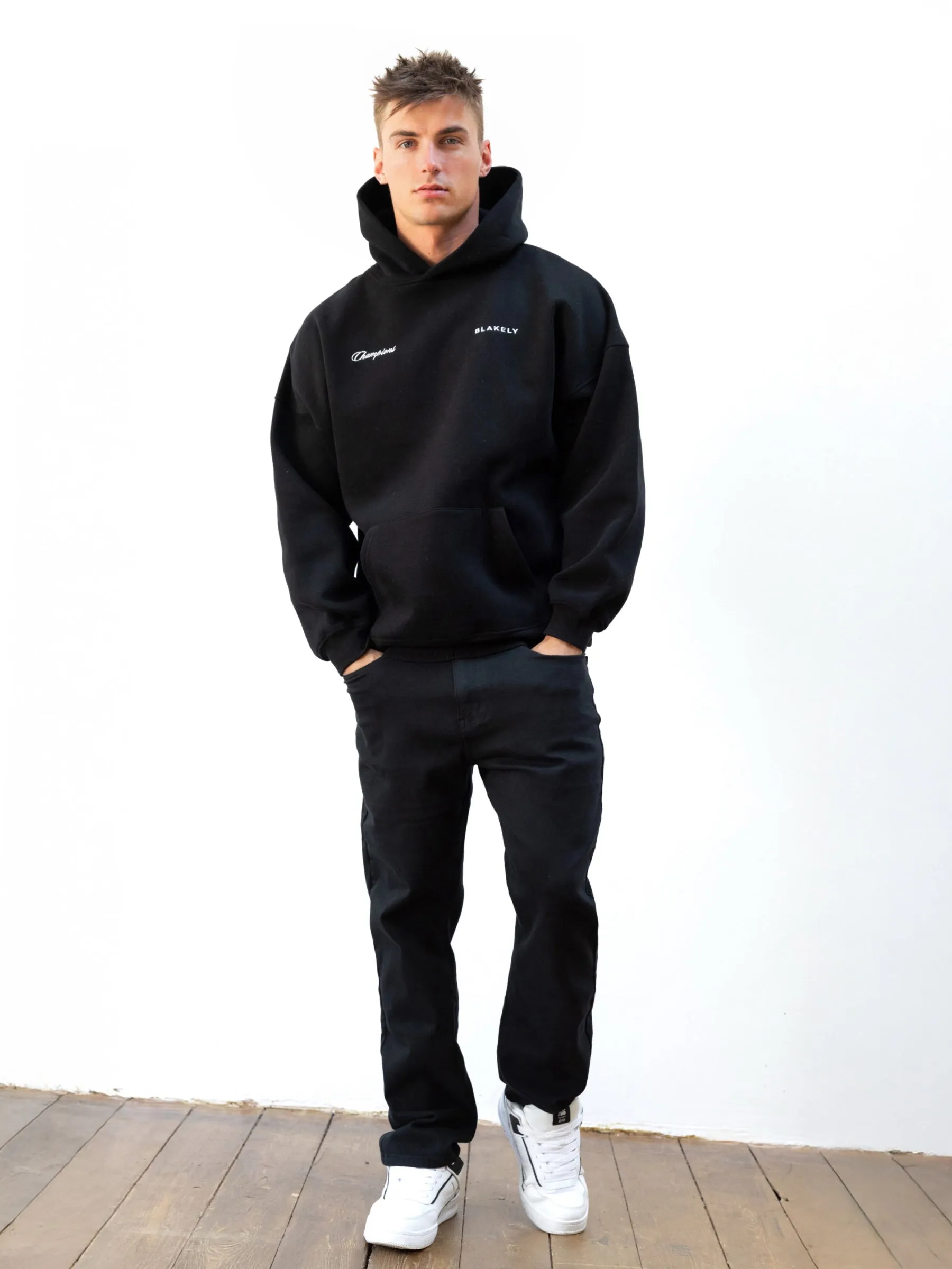 Champions Legacy Relaxed Hoodie - Black Street Inspired Sleeve Detail