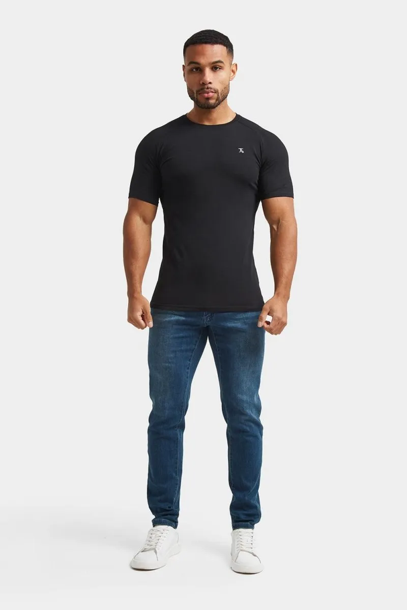 Balanced Piece Athletic Fit Jeans in Mid Blue