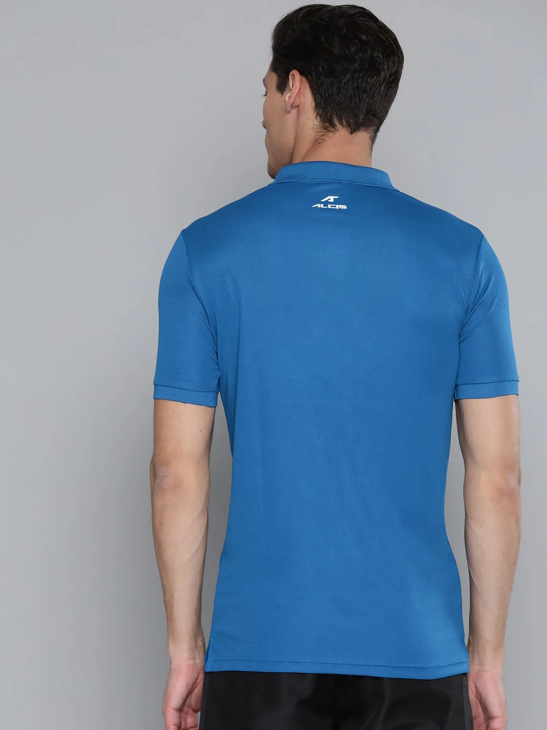 Tailored Silhouette Ventilated Side Panels Alcis Men Solid Blue Polo Neck T Shirt